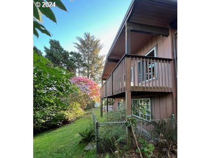 29280 Lacy Street Gold Beach, OR 97444 - Photo 23 of 38 a view of a house with a small yard
