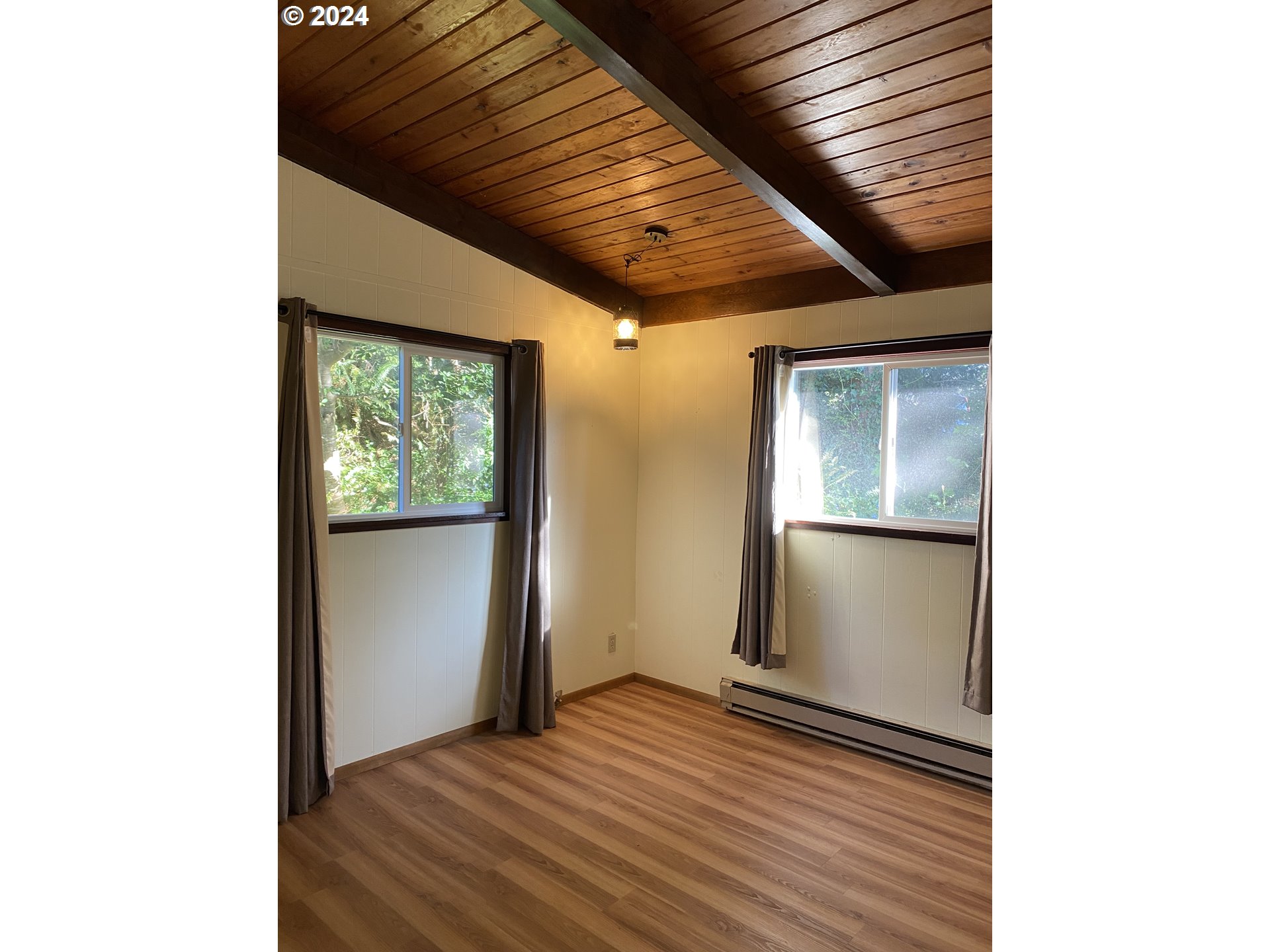 29280 Lacy Street Gold Beach, OR 97444 - Photo 26 of 38 a view of a hallway with wooden floor and a large window