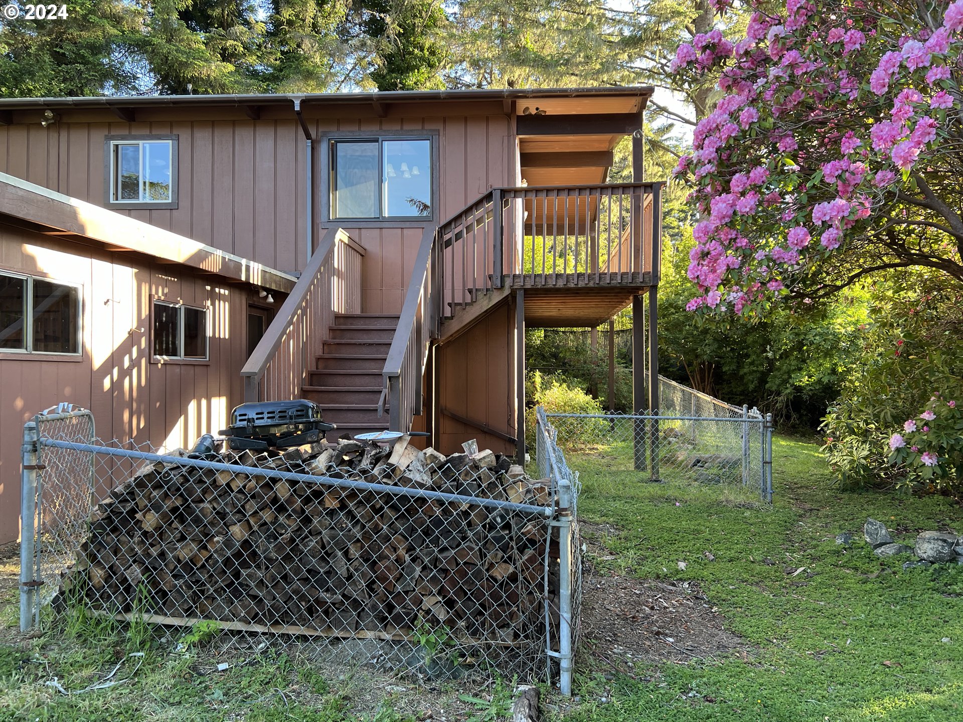 29280 Lacy Street Gold Beach, OR 97444 - Photo 34 of 38 a front view of a house with garden