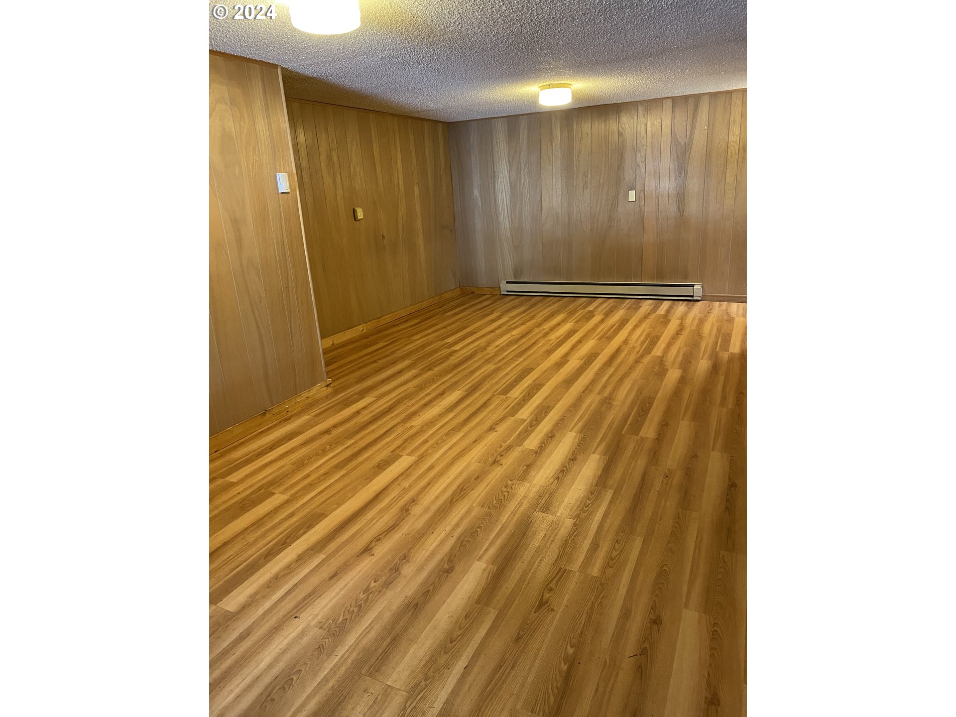 29280 Lacy Street Gold Beach, OR 97444 - Photo 9 of 38 a view of a hallway with wooden floor