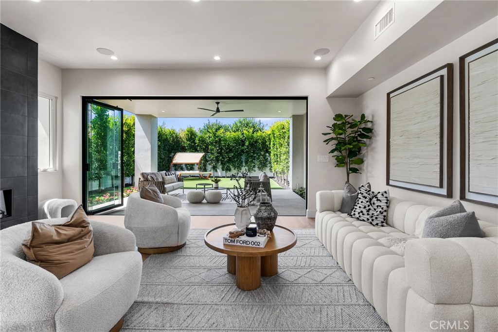 161 Cecil Place, Unit A Costa Mesa, CA 92627 - Photo 27 of 63 a living room with furniture and a large window