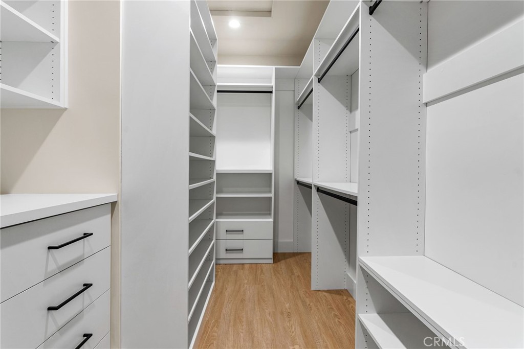 161 Cecil Place, Unit A Costa Mesa, CA 92627 - Photo 41 of 63 a view of walk in closet with empty racks