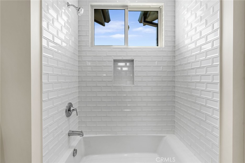 161 Cecil Place, Unit A Costa Mesa, CA 92627 - Photo 50 of 63 a bathroom with a bathtub