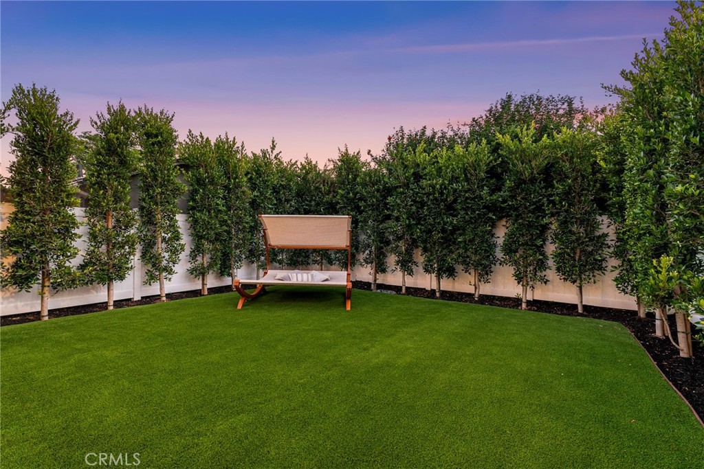 161 Cecil Place, Unit A Costa Mesa, CA 92627 - Photo 53 of 63 a backyard of a house with table and chairs