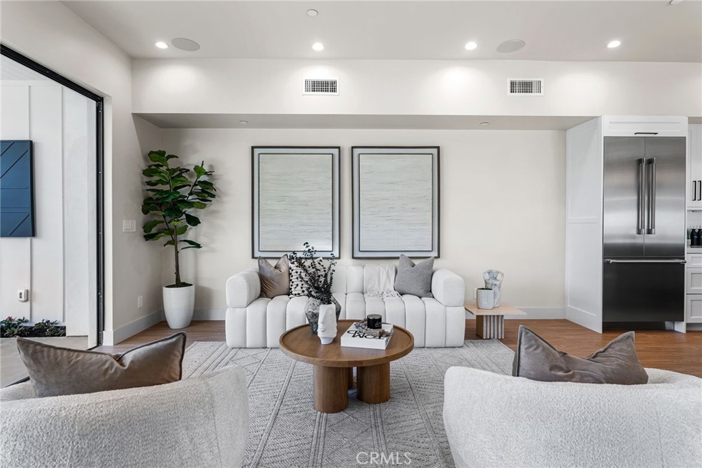 161 Cecil Place, Unit A Costa Mesa, CA 92627 - Photo 57 of 63 a living room with furniture and a potted plant