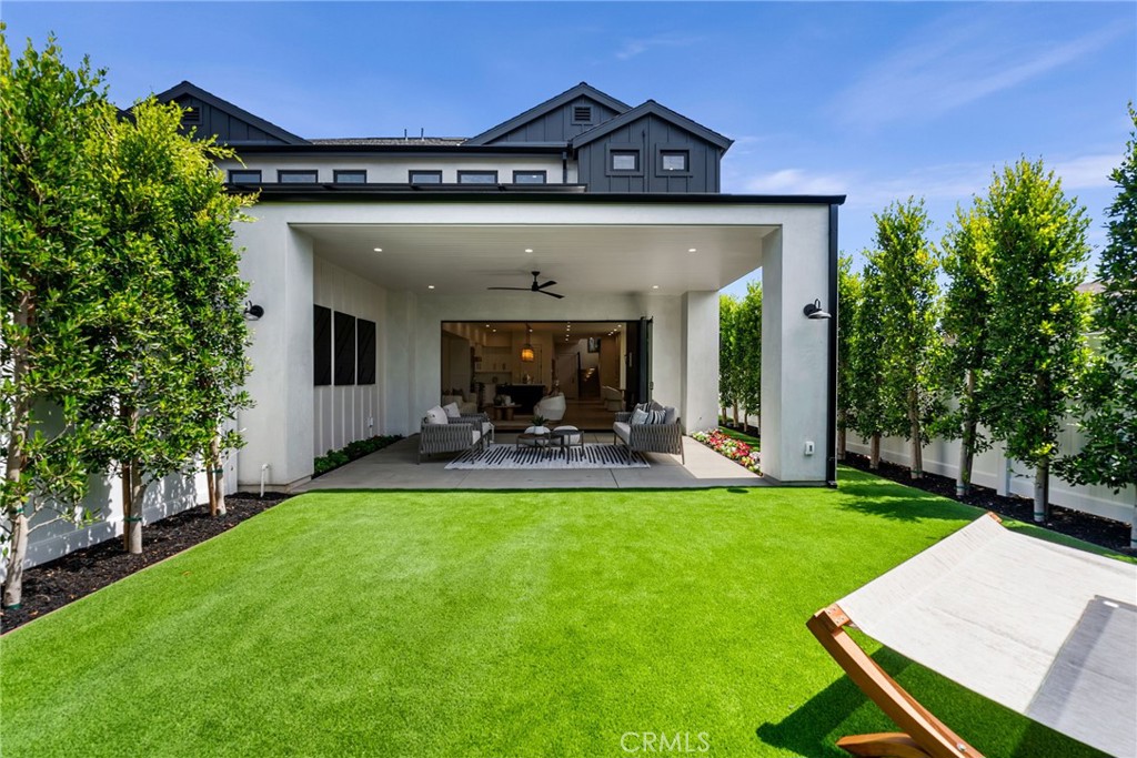 161 Cecil Place, Unit A Costa Mesa, CA 92627 - Photo 60 of 63 a view of a house with a yard porch and sitting area