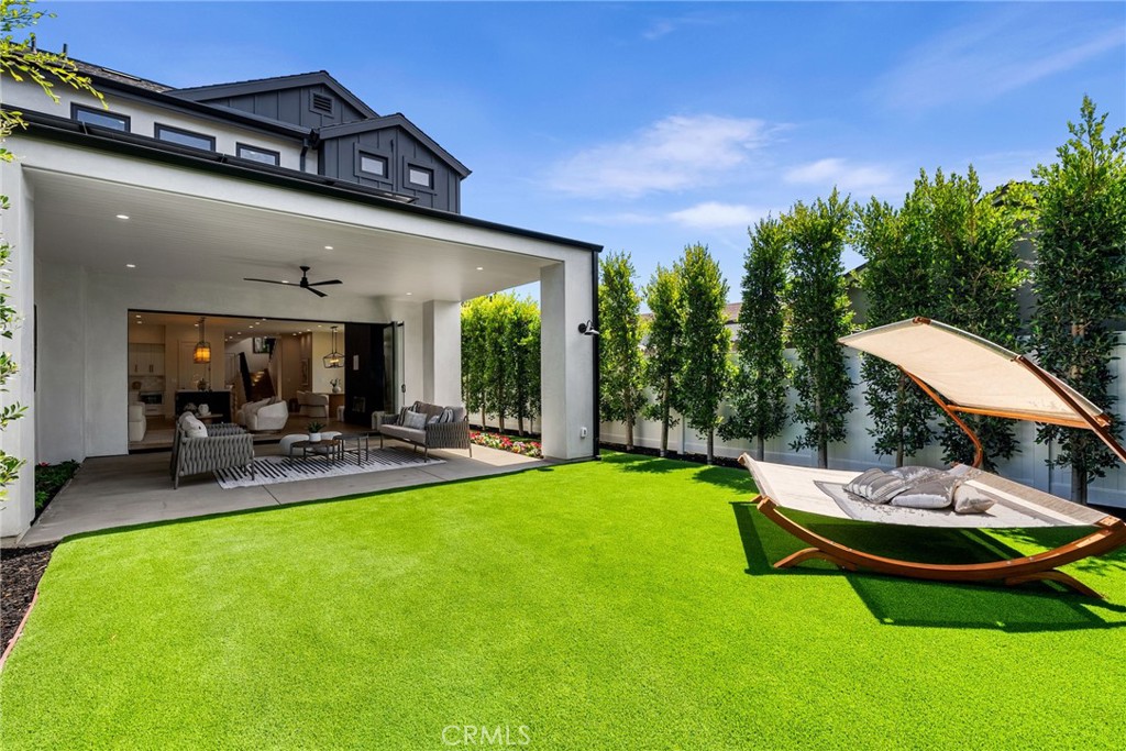 161 Cecil Place, Unit A Costa Mesa, CA 92627 - Photo 62 of 63 a view of a swimming pool and lounge chairs