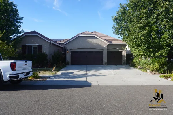 a front view of a house with street