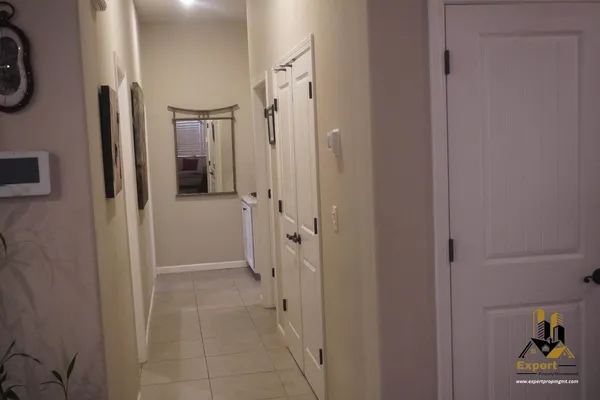 a bathroom with a sink mirror and toilet