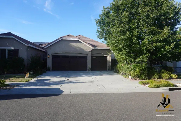 a front view of a house with yard