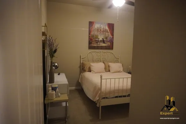 a bathroom with a shower and a sink