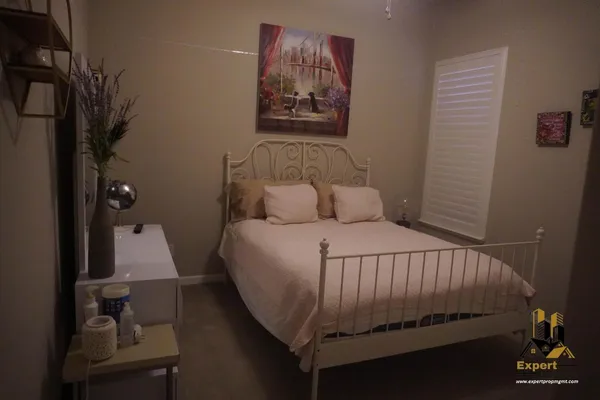 a white toilet sitting next to a shower curtain