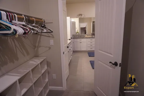 a bedroom with a bed and a television in it