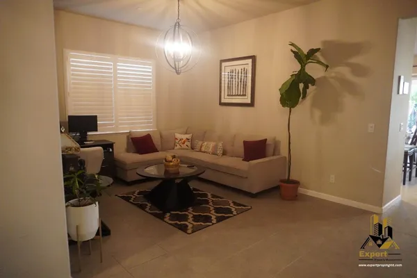 a large bathroom with a granite countertop sink a mirror and a shower