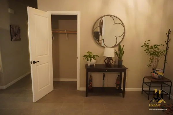 a kitchen with a stove a sink a dining table and chairs