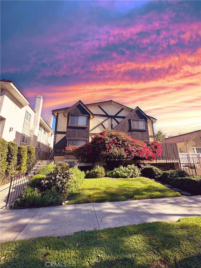a view of a big house with a big yard