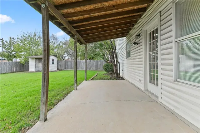a view of backyard with green space