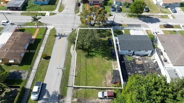 an aerial view of houses with outdoor space
