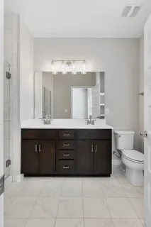 a bathroom with a sink vanity and mirror