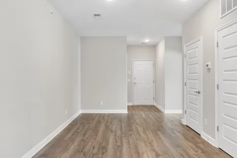 a view of wooden floor in an empty room