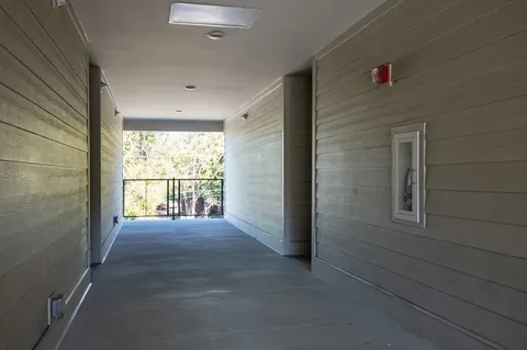 a view of an empty room and a window