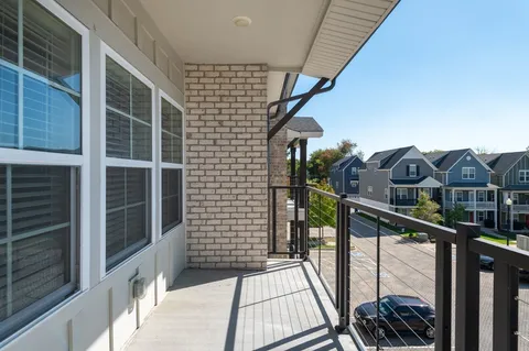 a view of a balcony with a potted plant