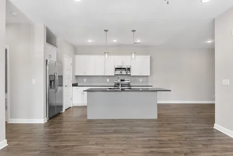 a view of kitchen with wooden floor