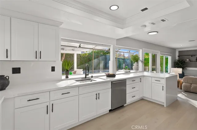a kitchen with sink cabinets and window