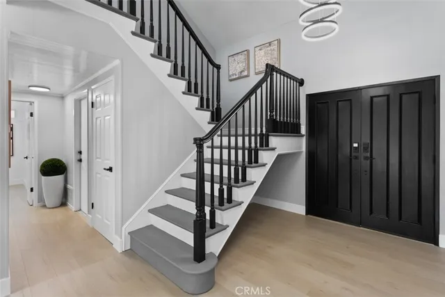 a living room with furniture kitchen view and a table