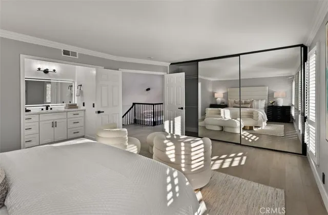 a bathroom with a double vanity sink toilet and shower