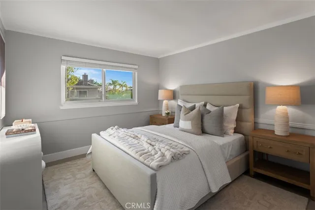 a bedroom with bed and window