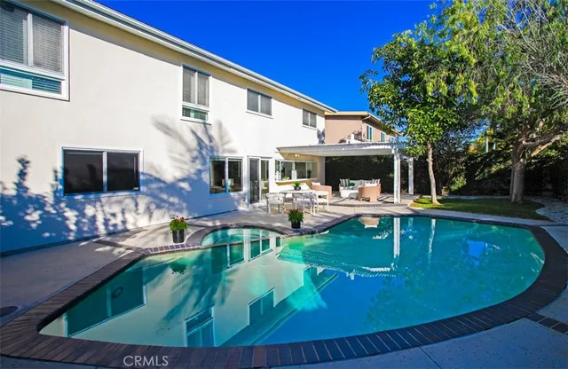 a view of a swimming pool with a patio