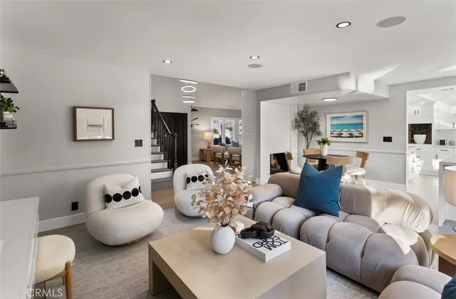 a living room with furniture and a mirror