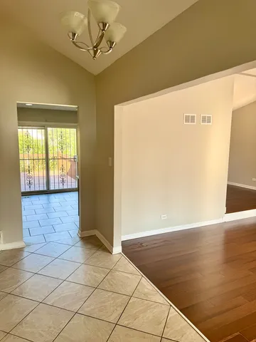 a view of hallway with wooden floor
