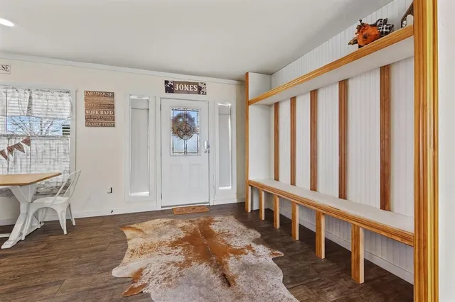 a view of entryway with wooden floor