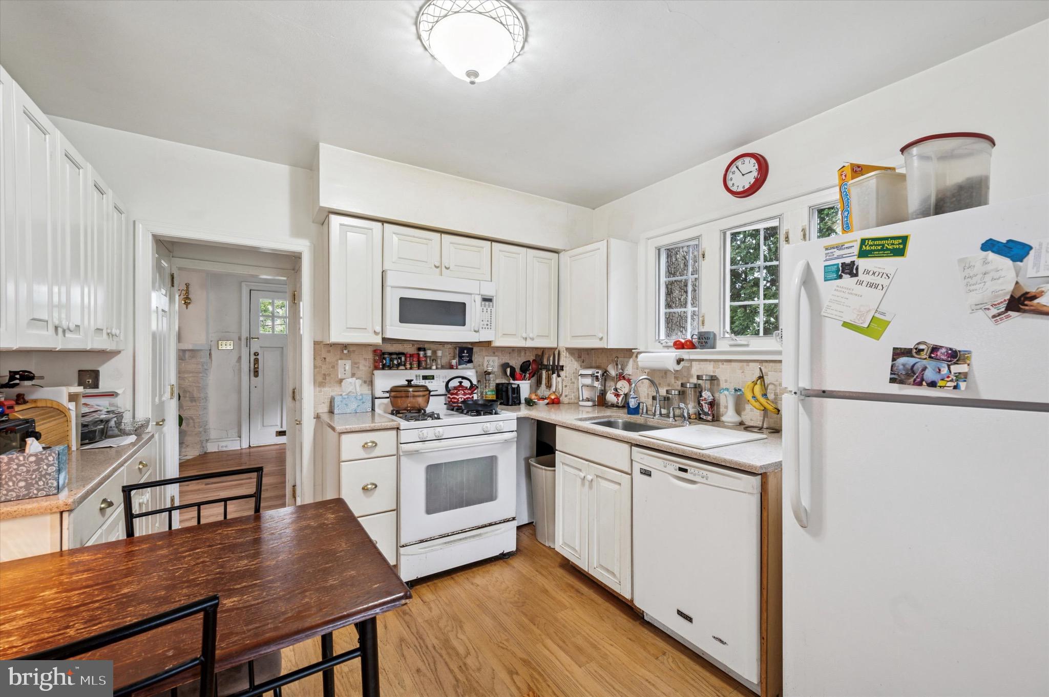 15 Oakland Road Broomall, PA 19008 - Photo 12 of 27 a kitchen with white cabinets and stove