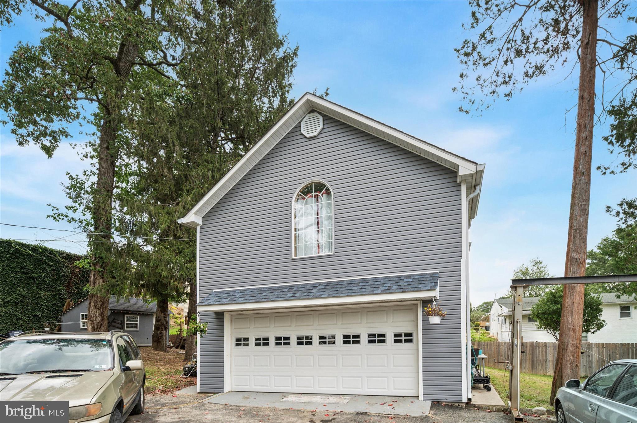 15 Oakland Road Broomall, PA 19008 - Photo 26 of 27 a front view of a house with a garage