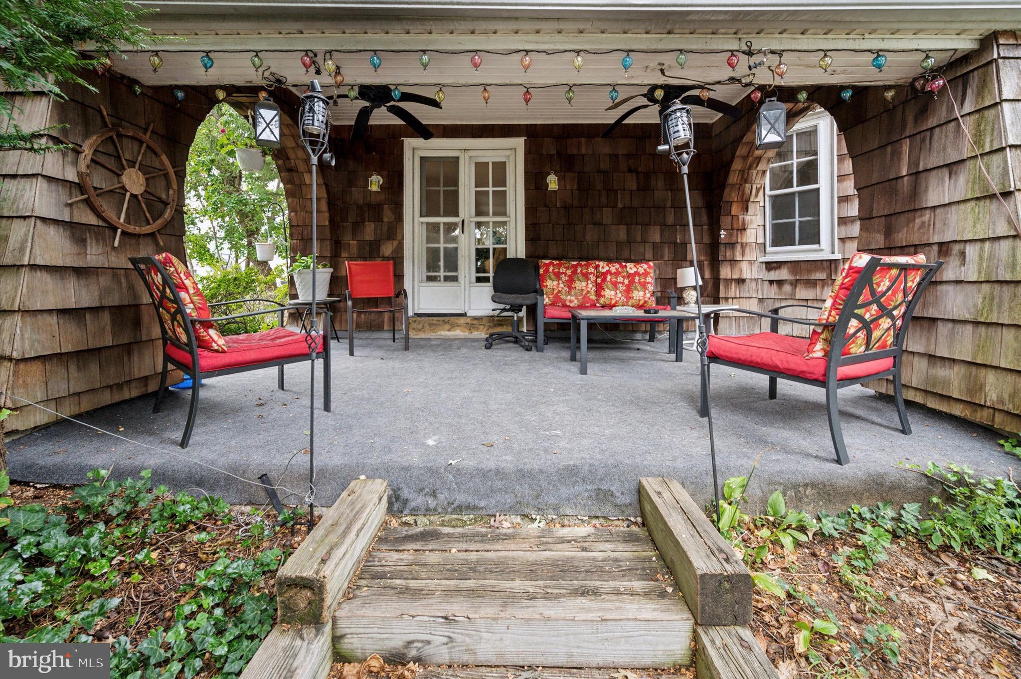 15 Oakland Road Broomall, PA 19008 - Photo 4 of 27 an outdoor sitting area with a couch and a table