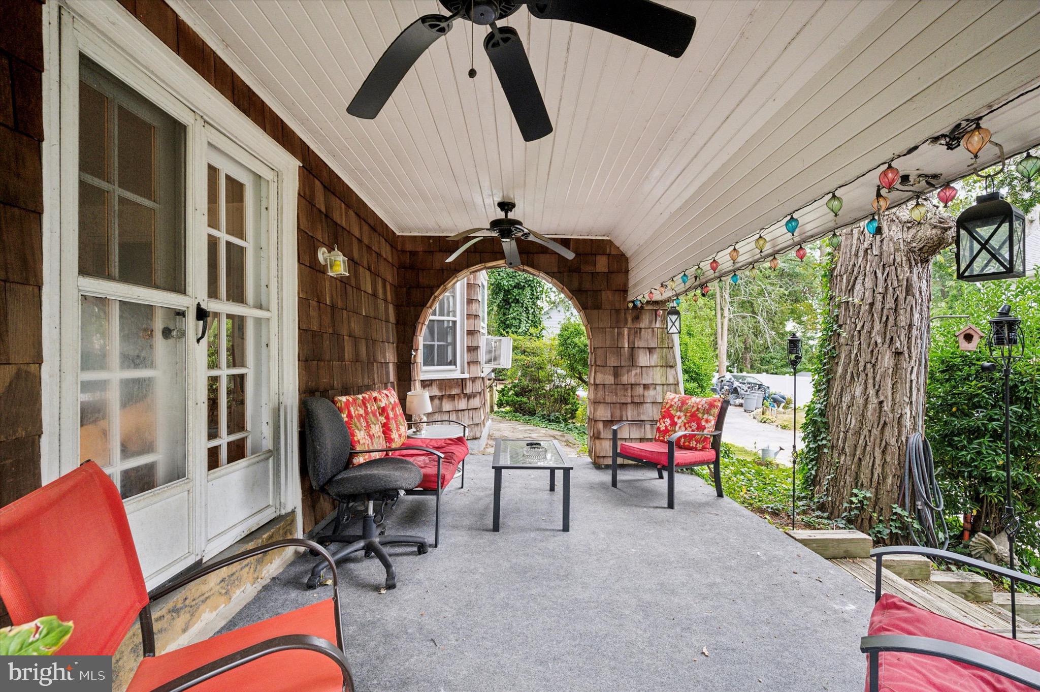 15 Oakland Road Broomall, PA 19008 - Photo 5 of 27 a living room with patio furniture and a floor to ceiling window