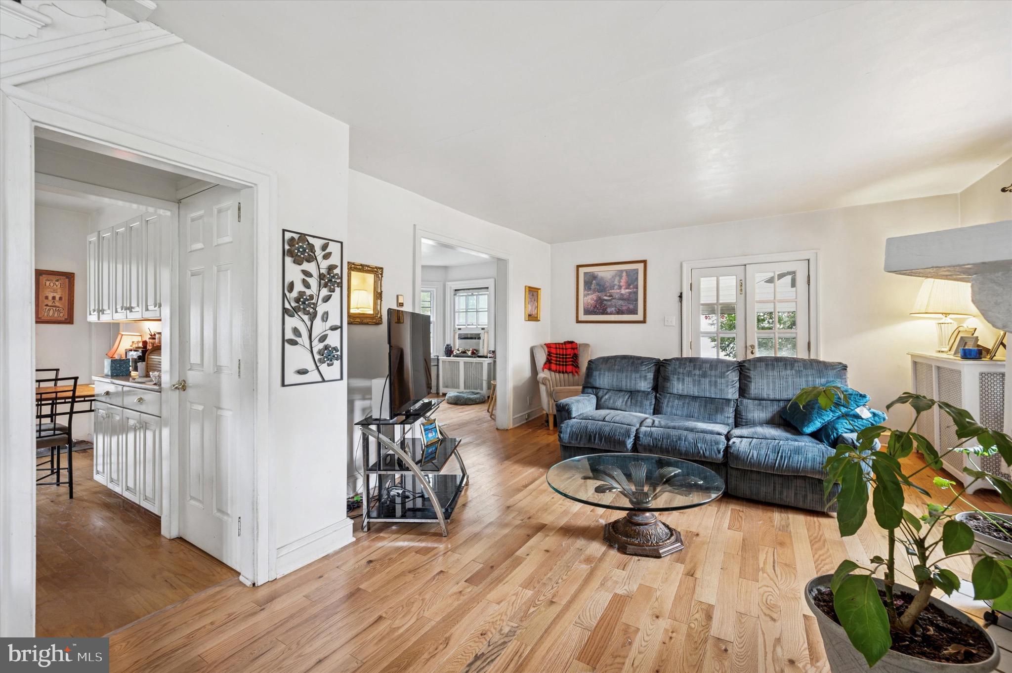 15 Oakland Road Broomall, PA 19008 - Photo 6 of 27 a living room with furniture a wooden floor and next to a window