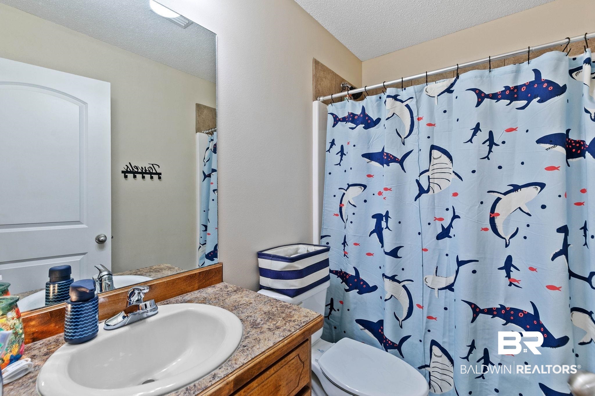 55750 Lottie Road Perdido, AL 36562 - Photo 45 of 84 Bathroom featuring vanity, a shower with shower curtain, and a textured ceiling