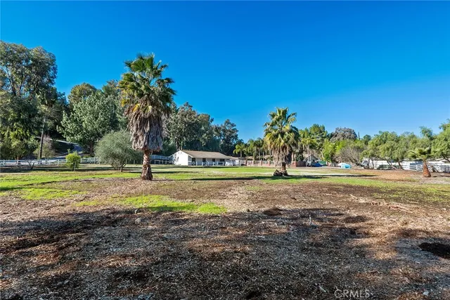 a view of a swimming pool with a yard