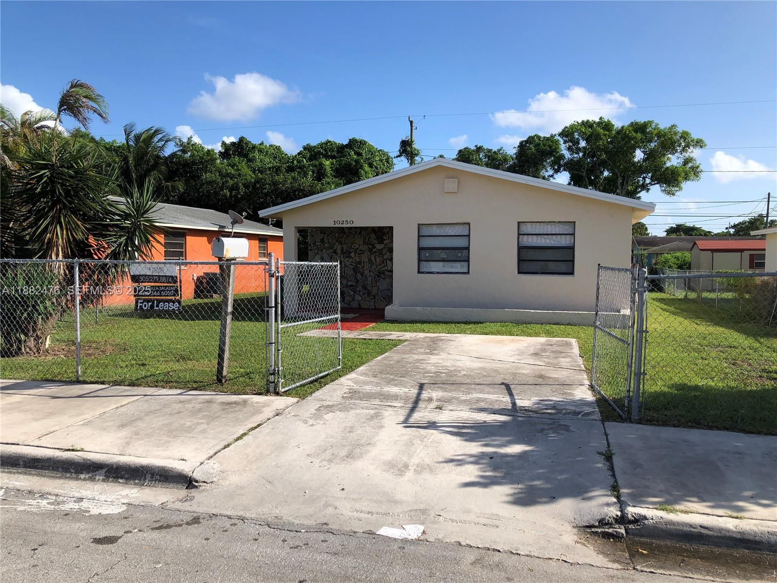 10250 Southwest 172nd Street Miami, FL 33157 - Photo 1 of 39 a house view with a backyard space