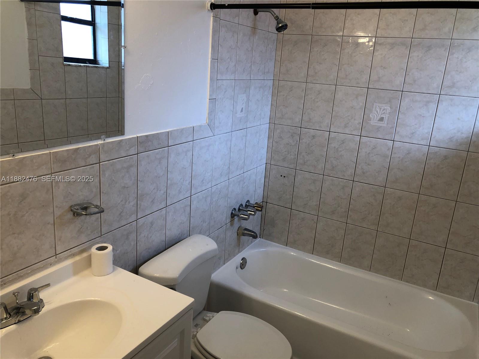 10250 Southwest 172nd Street Miami, FL 33157 - Photo 15 of 39 a bathroom with a sink toilet and shower