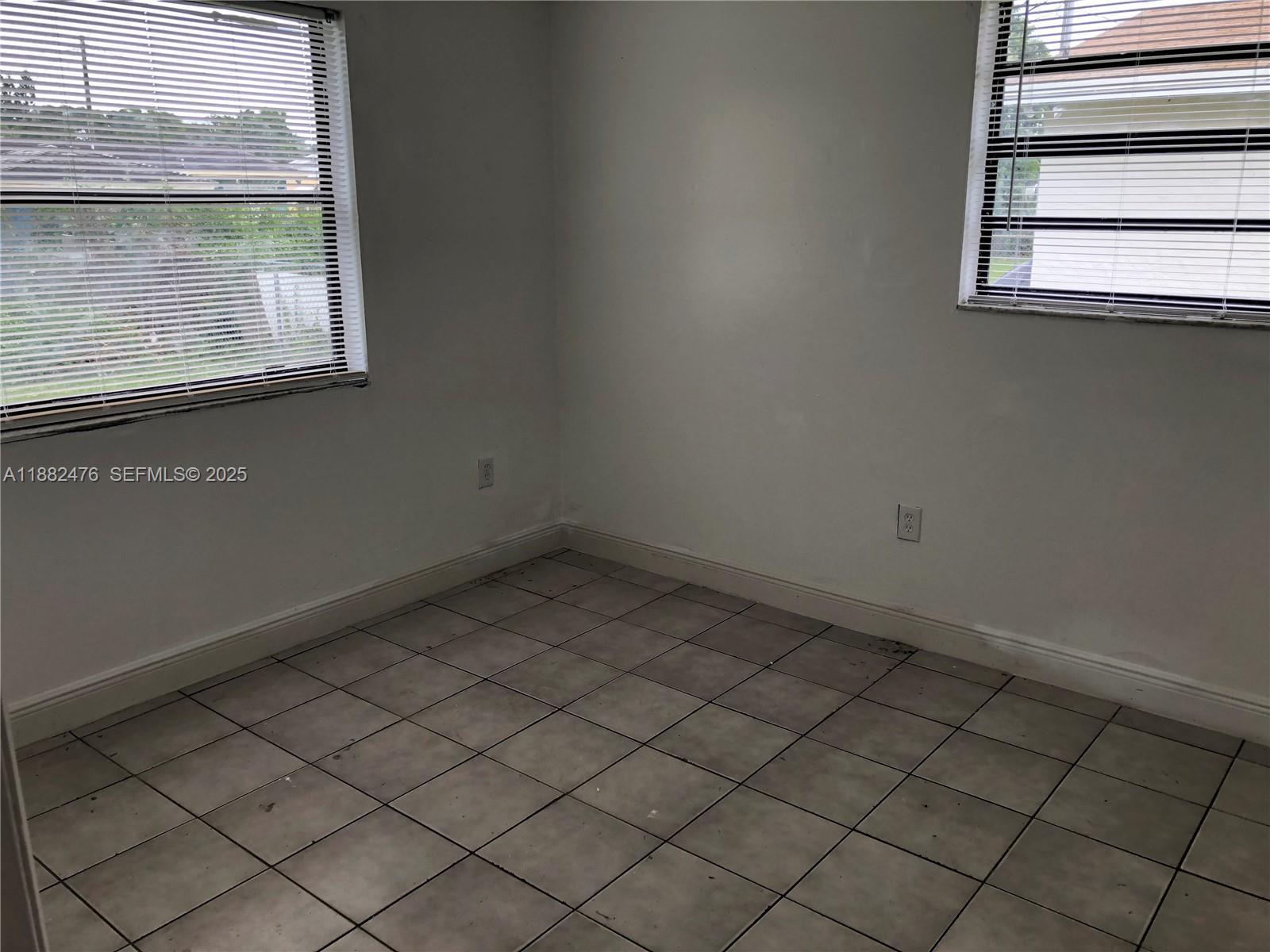 10250 Southwest 172nd Street Miami, FL 33157 - Photo 18 of 39 an empty room with a window