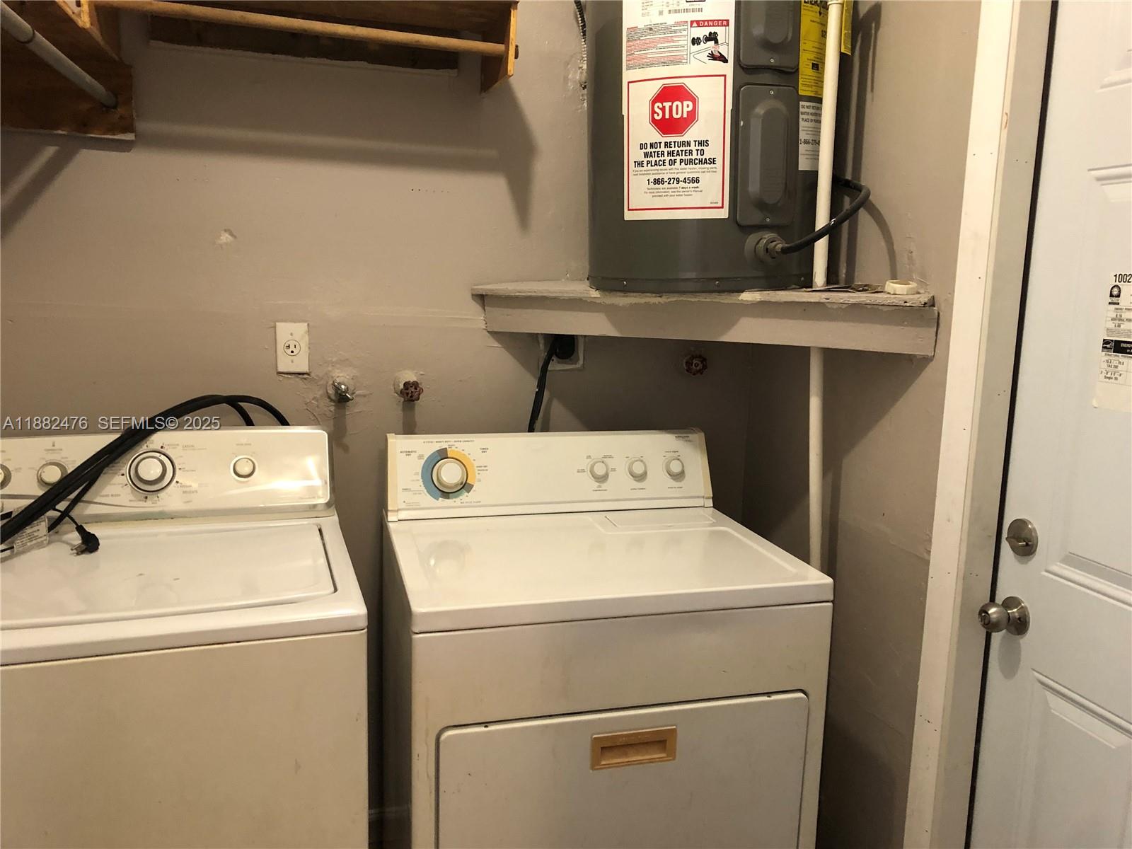 10250 Southwest 172nd Street Miami, FL 33157 - Photo 19 of 39 a utility room with dryer and washer