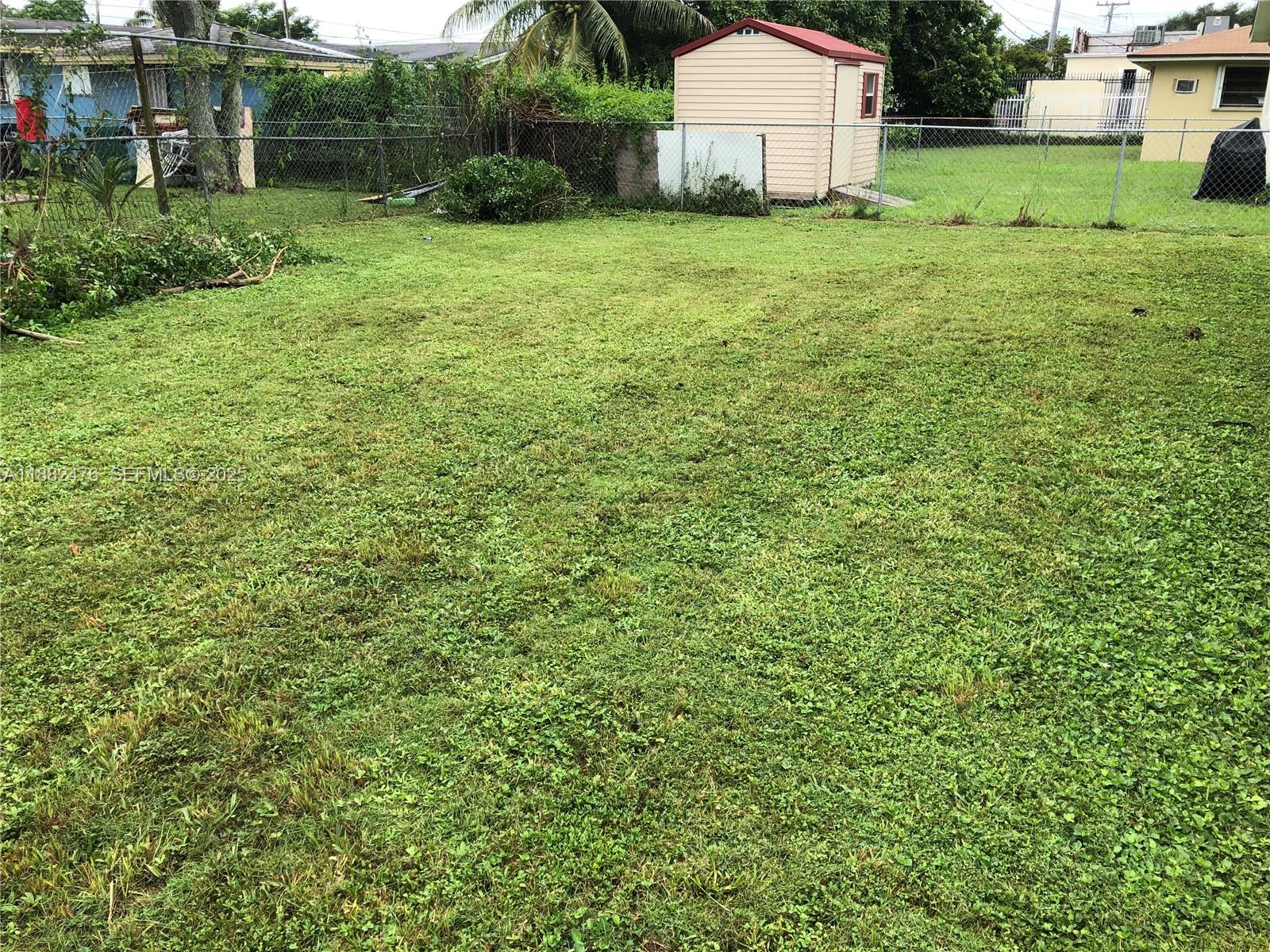 10250 Southwest 172nd Street Miami, FL 33157 - Photo 21 of 39 a view of a backyard with a garden and entertaining space