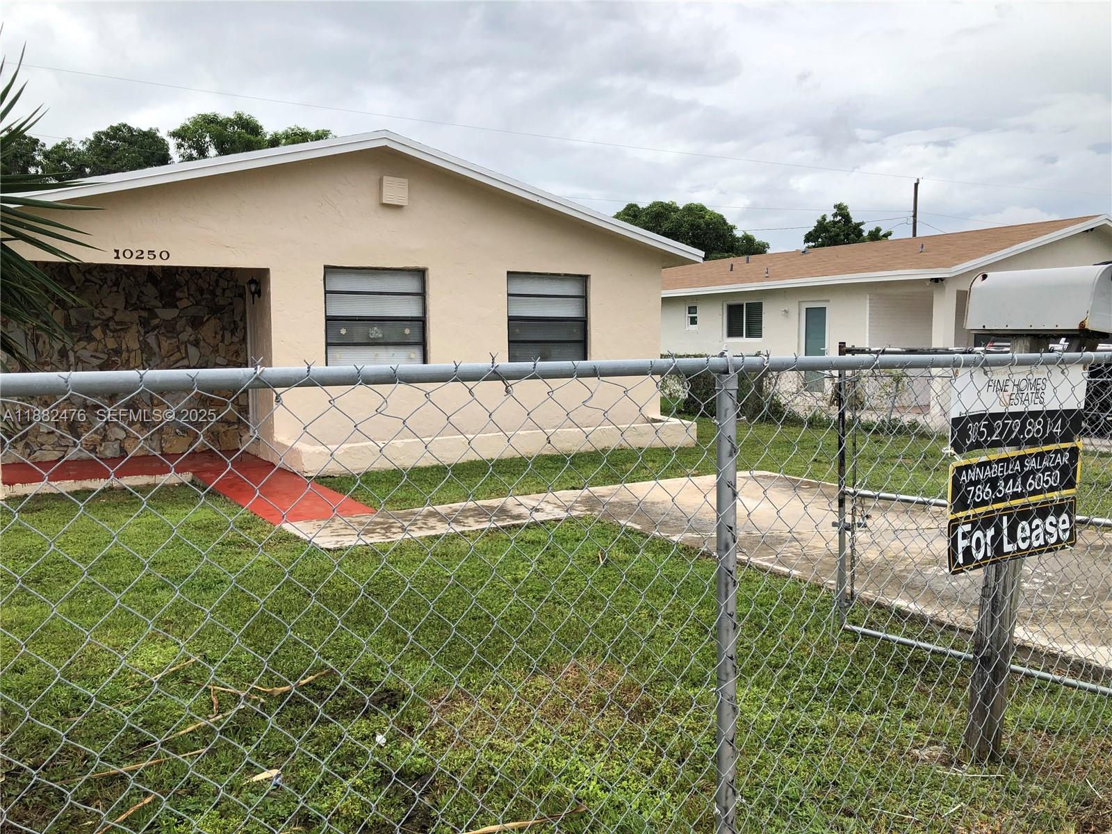 10250 Southwest 172nd Street Miami, FL 33157 - Photo 23 of 39 a view of a house with backyard