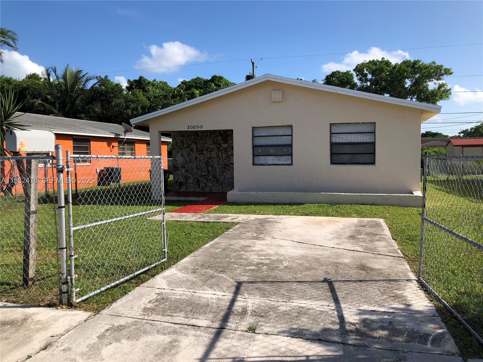 10250 Southwest 172nd Street Miami, FL 33157 - Photo 27 of 39 a front view of house with yard