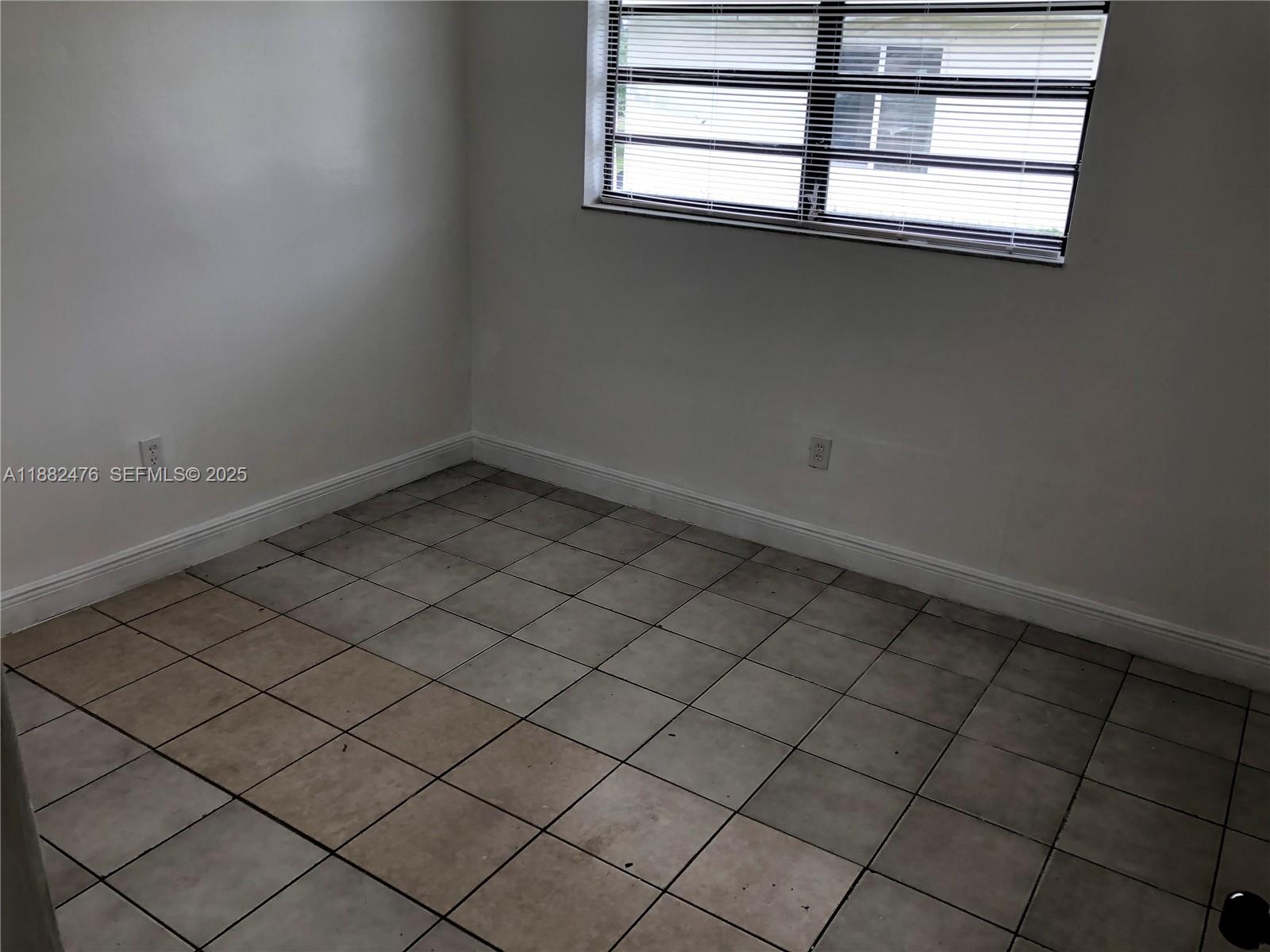10250 Southwest 172nd Street Miami, FL 33157 - Photo 28 of 39 an empty room with a window